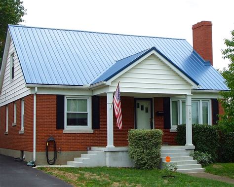 blue metal roof on brick house|blue roof house.